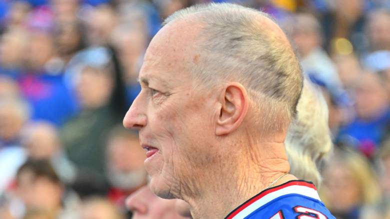 Former NFL quarterback Jim Kelly stands during the playing of the U.S. national anthem.