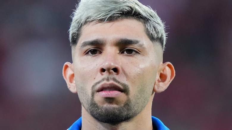 Julio Enciso of Paraguay looks on.