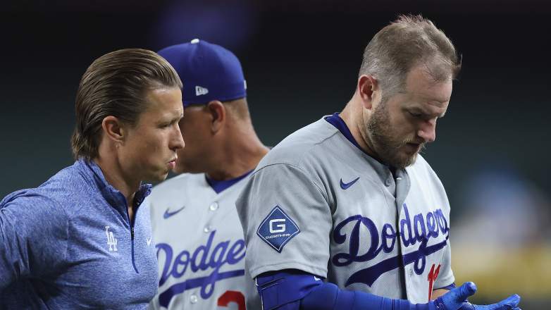 Los Angeles Dodgers third baseman Max Muncy leaves the field after a collision with Arizona Diamondbacks first baseman Ildemaro Vargas at Chase Field.