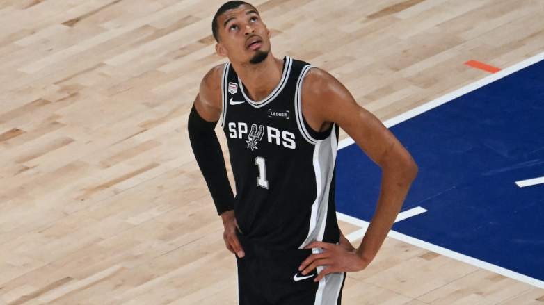 San Antonio Spurs' French forward-center #01 Victor Wembanyama looks up.