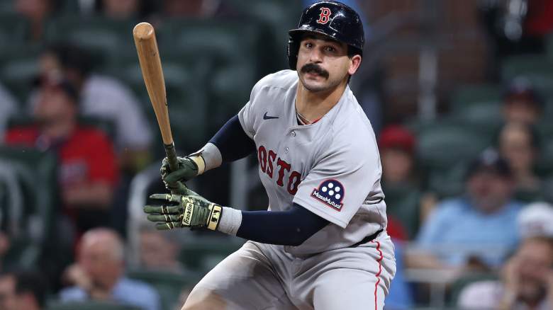 Boston Red Sox catcher Mickey Gasper follows through on a swing during a road game.