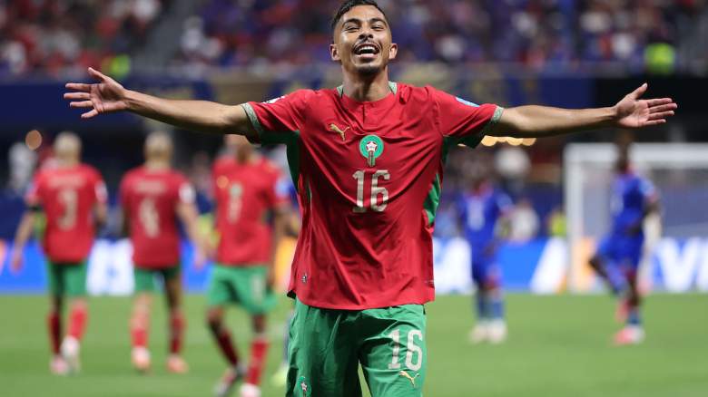 Gessime Yassine #16 of Morocco celebrates.