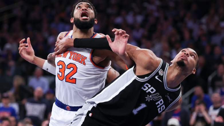 Victor Wembanyama #1 of the San Antonio Spurs and Karl-Anthony Towns #32 of the New York Knicks battle.