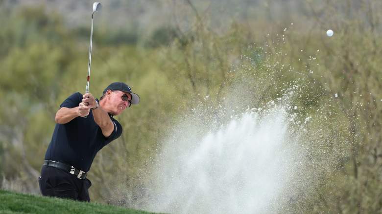 Captain Phil Mickelson of Hyflyers GC chips from the bunker.