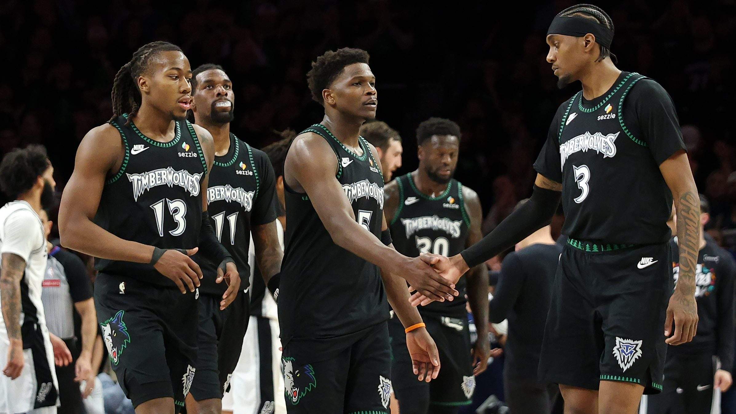 Ayo Dosunmu, Anthony Edwards, and Jaden McDaniels