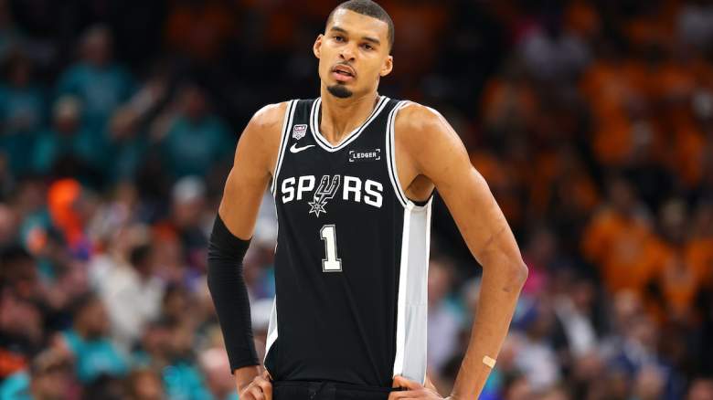 Victor Wembanyama #1 of the San Antonio Spurs reacts.