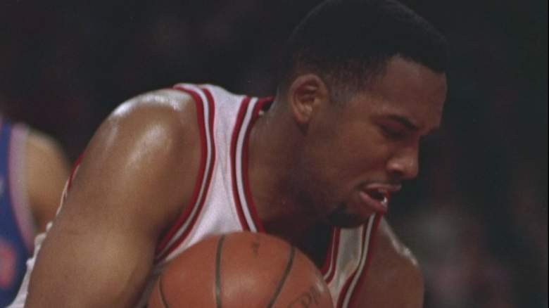 Center Stacey King of the Chicago Bulls looks on after knocking a Cleveland Cavaliers player to the deck.