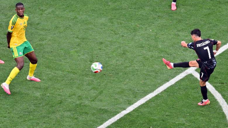 Canada's midfielder #07 Stephen Eustaquio scores his team's first goal.