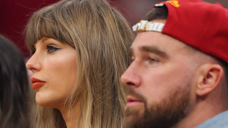 Singer Taylor Swift and Travis Kelce of the Kansas City Chiefs watch a game.