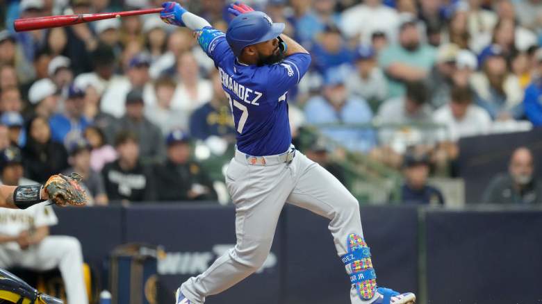 Teoscar HernÃ¡ndez #37 of the Los Angeles Dodgers watches his three-run home run.