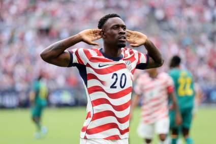 Folarin ‘Flo’ Balogun’s Parents’ Unlikely Story Has Ties to England, Nigeria & USA