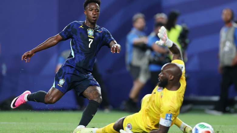 Vinicius Junior #7 of Brazil scores his team's third goal.