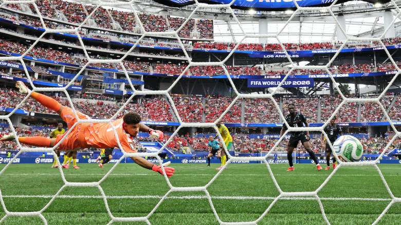 Ronwen Williams #1 of South Africa fails to save a shot from Stephen Eustaquio.