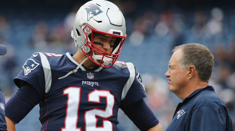 Tom Brady talks with Patriots head coach Bill Belichick before a game against the Houston Texans in 2018.