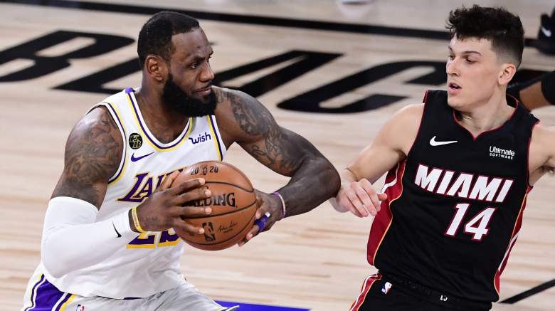LeBron James protects the ball against Tyler Herro during the 2020 NBA Finals between the Lakers and Heat.