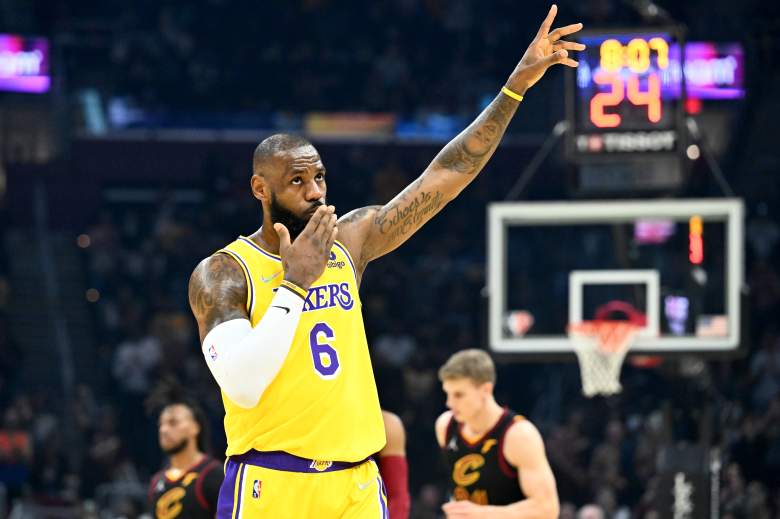 LeBron James raises his arm during a Los Angeles Lakers road game against the Cleveland Cavaliers.