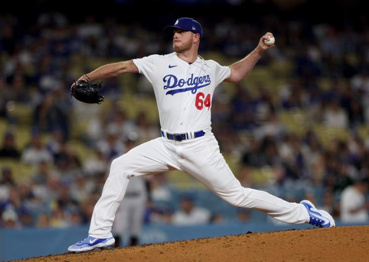 Los Angeles Dodgers calls uses choice words at umpire Bill Miller after colliding with Cincinnati Reds infielder.