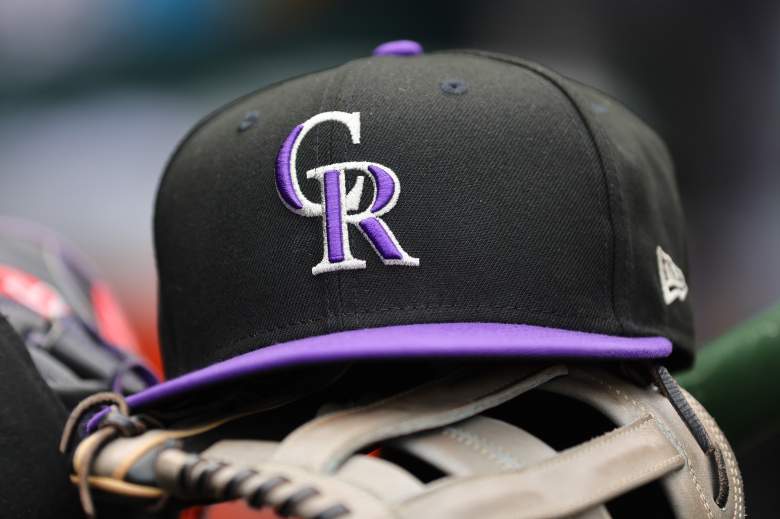 Colorado Rockies hat on a glove during a game against the Chicago Cubs