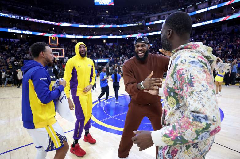 Stephen Curry, Anthony Davis, LeBron James and Draymond Green share a moment after a Lakers-Warriors game