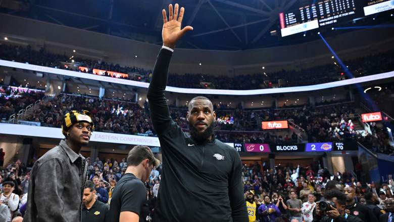 LeBron James waves to fans before a Los Angeles Lakers game against the Cleveland Cavaliers amid free agency speculation.