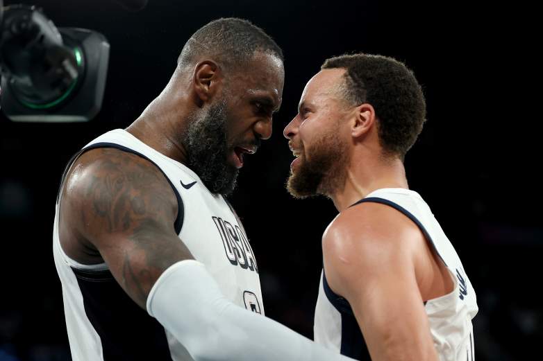 LeBron James and Stephen Curry celebrate while playing together for Team USA at the Paris Olympics