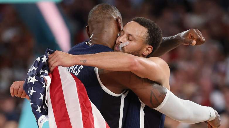 LeBron James and Stephen Curry embrace after winning gold at 2024 Paris Olympics