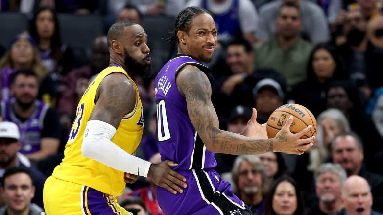 DeMar DeRozan posts up LeBron James during a Sacramento Kings vs. Los Angeles Lakers NBA game as the veteran enters NBA free agency.