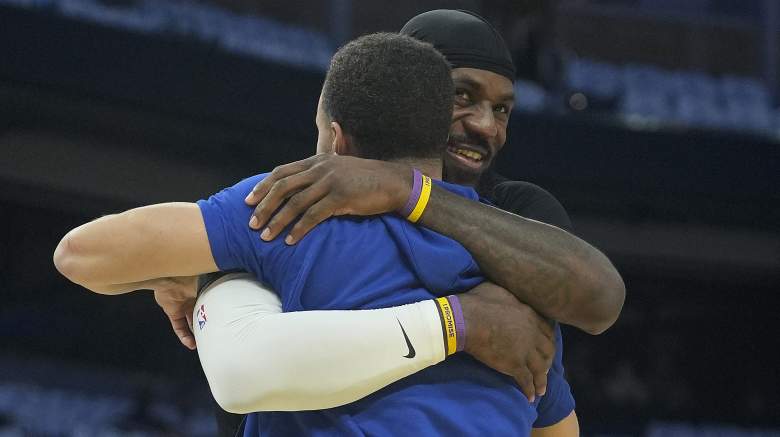 LeBron James hugs Stephen Curry before an NBA game as the Warriors remain linked to the four-time MVP in free agency.