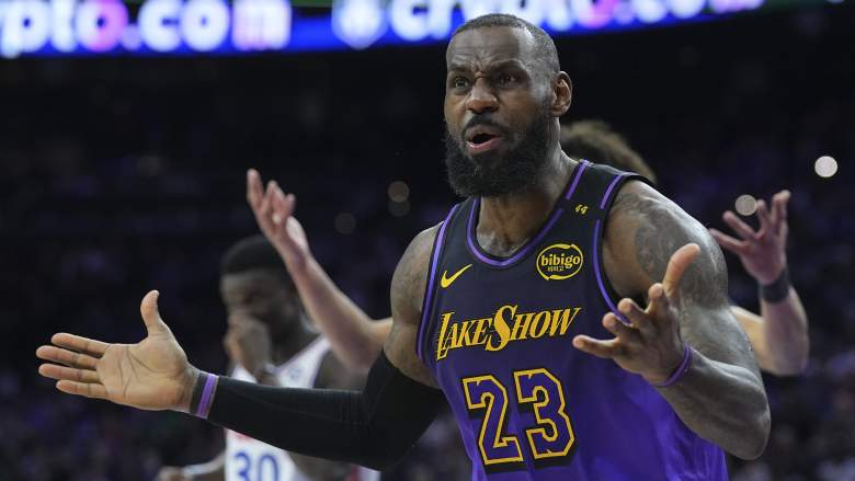 LeBron James reacts with his arms extended during a Los Angeles Lakers game