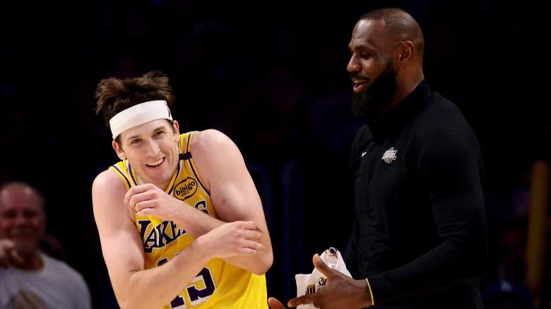 Austin Reaves laughs with LeBron James during a Los Angeles Lakers game before reflecting on James' impact on his NBA career.