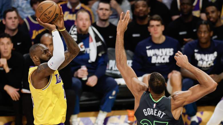LeBron James attempts a jump shot over Minnesota Timberwolves center Rudy Gobert