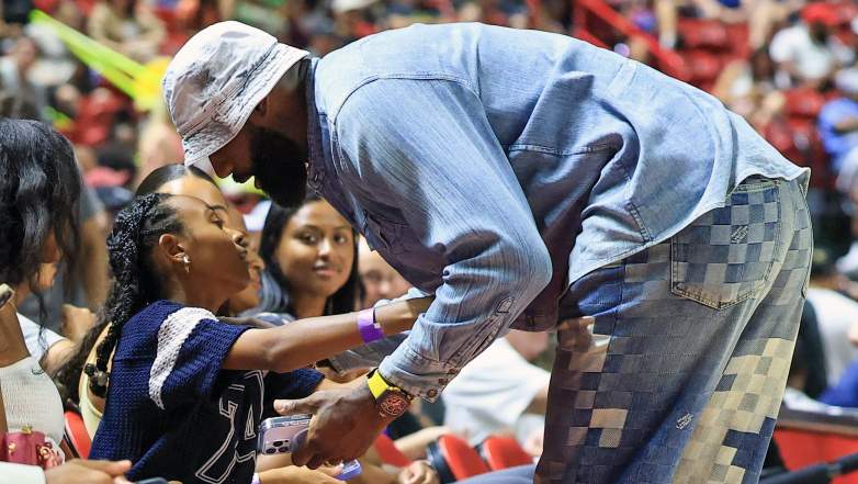 LeBron James greets his daughter, Zhuri, during an NBA Summer League game in Las Vegas.