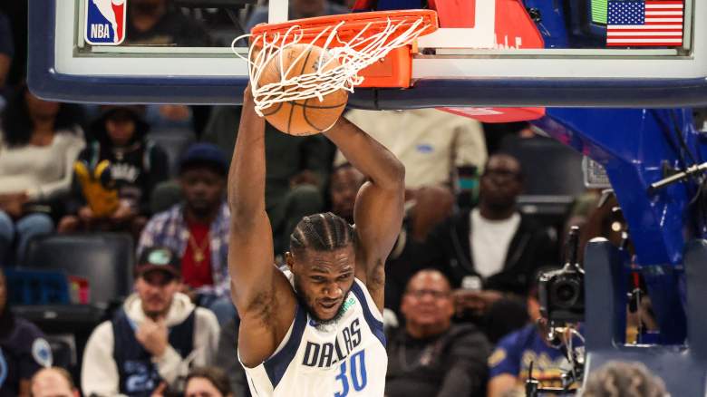 Dallas Mavericks center Moussa Cissé dunks during an NBA game after the team matched the New York Knicks' restricted free-agent offer sheet.