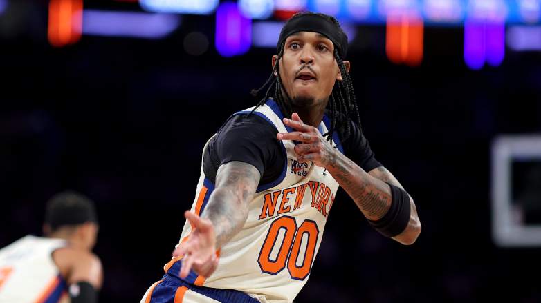 New York Knicks guard Jordan Clarkson performs a signature celebration during an NBA game.