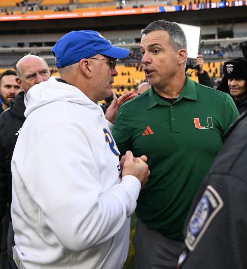 Pittsburgh head coach Pat Nardizzi and Miami head coach Mario Cristobal