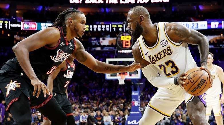 Jabari Walker defends LeBron James during a Lakers game against the Philadelphia 76ers.