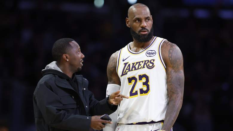 LeBron James stands beside longtime agent Rich Paul during a Los Angeles Lakers game.