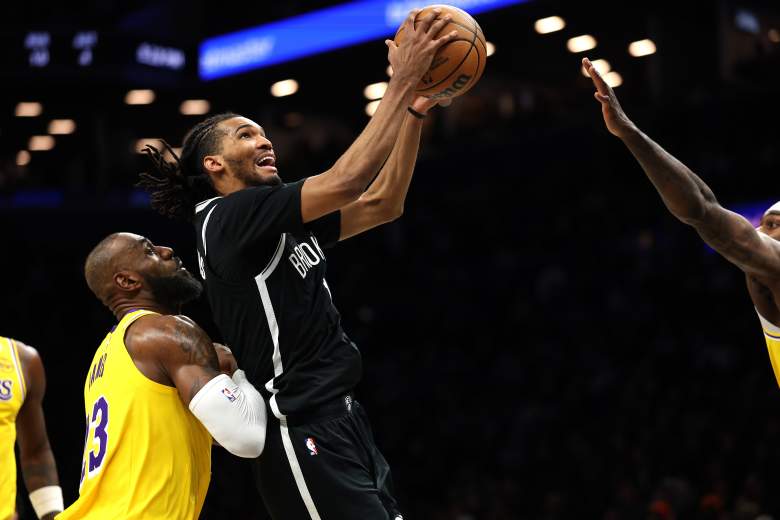 Brooklyn Nets forward Ziaire Williams goes up for a layup against LeBron James during a game against the Los Angeles Lakers.
