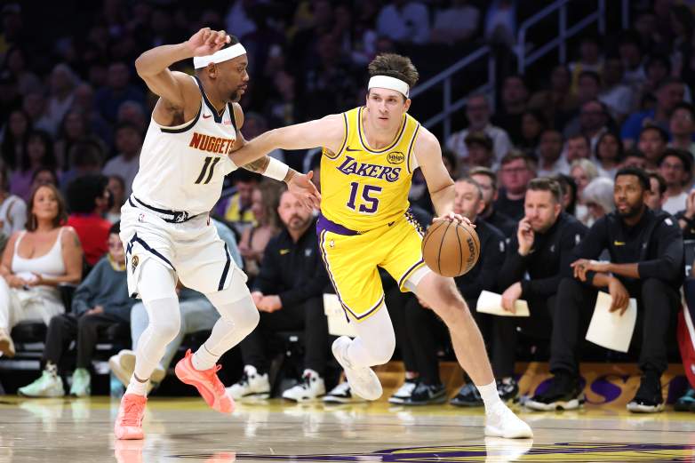 Austin Reaves drives past Bruce Brown during a Los Angeles Lakers vs. Denver Nuggets game.