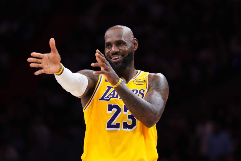 LeBron James smiles and gestures during a Los Angeles Lakers game against the Miami Heat