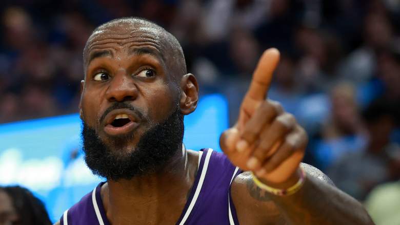 LeBron James #23 is being chased by the Warriors