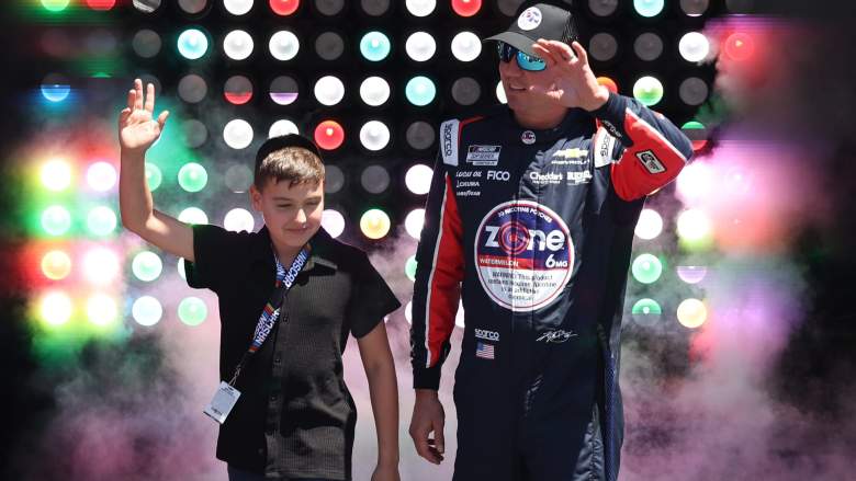 Kyle Busch walks with son Brexton Busch before a NASCAR Cup Series race at Texas Motor Speedway.