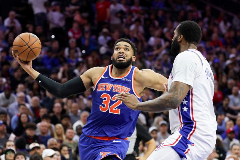 Karl-Anthony Towns drives to the basket against Andre Drummond during an NBA game before the two became teammates with the New York Knicks.
