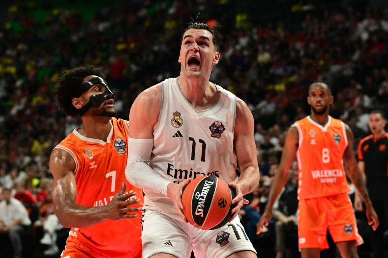 Mario Hezonja drives toward the basket for Real Madrid while being defended during a EuroLeague game.
