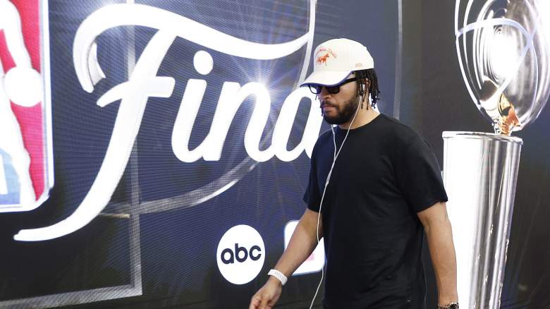 New York Knicks star Jalen Brunson walks toward the court wearing headphones before an NBA Finals game.