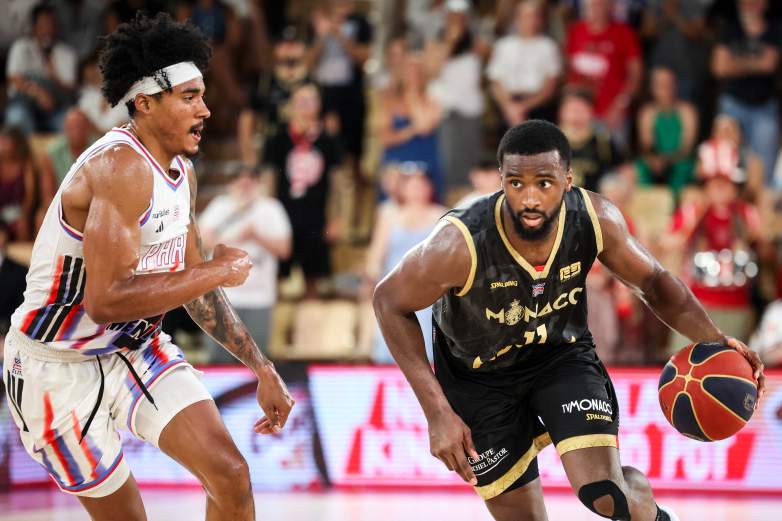 AS Monaco's US forward #11 Alpha Diallo (R) runs with the ball during the French Ligue Nationale de Basket (LNB Elite) Pro A game four of the final between AS Monaco Basket and Paris Basketball, at the Gaston Medecin arena in Monaco on June 21, 2026. (Photo by Valery HACHE / AFP via Getty Images)