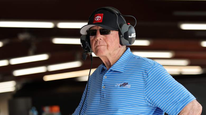 Joe Gibbs watches practice from the garage area at Chicagoland Speedway before the NASCAR Cup Series race weekend.
