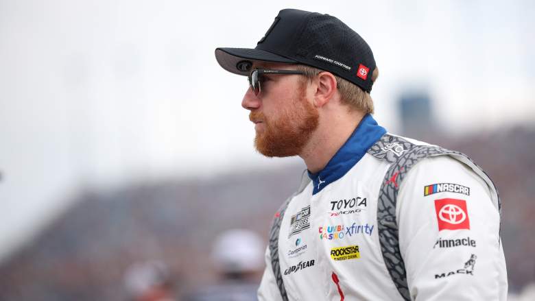 Tyler Reddick waits beside his No. 45 Toyota before the NASCAR Cup Series eero 400 at Chicagoland Speedway.