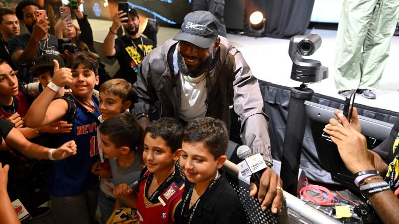 LeBron James poses with young fans during Fanatics Fest in New York as the Cleveland Cavaliers remain in contention to sign him in free agency.