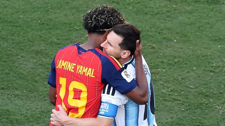 Lamine Yamal and Lionel Messi embrace on the field following the 2026 FIFA World Cup final between Spain and Argentina.